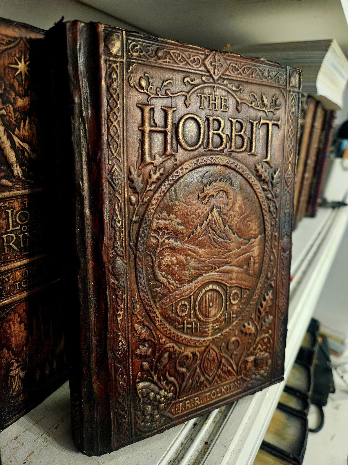 Another original front perspective, lettering and embossed fine relief retained. — original photograph, binding example